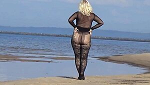 mature blonde teases big tits and ass flashing naturally on beach