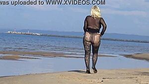 mature blonde teases big tits and ass flashing naturally on beach