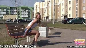 babe in lingerie teases flashing her panties from short skirt outside