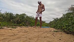 Intriguing african beach handjob ends in massive cumshot explosion