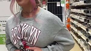 hey, check out this busty babe flashing pierced tits everywhere in the store