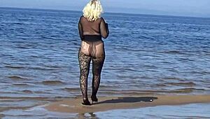 mature blonde teases big tits and ass flashing naturally on beach