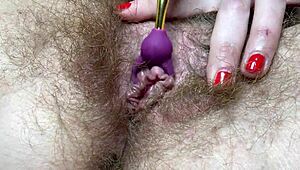 Teasing big clit with new vibrator in hairy pussy closeup