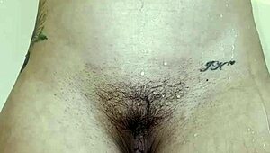 Her Plump Ass Teases with Steamy Shower Pee Show