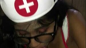 Latina Nurse Cares For Young Patient In Hospital