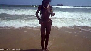 Skinny Tribe Slut Bares Tits at Beach
