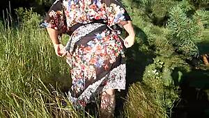 Hairy chubby mature flashes wet beaver under skirt on public nudist beach