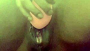 Webcam squirting close-up captures intense wet pussy release
