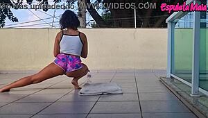 brunette's curvy ass cheeks peek from tucked-up shorts during outdoor training