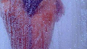 check out this tanned college latina's big ass shaking in her bikini shower