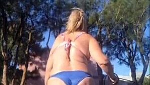 madrasta struts in new bikini around the home garden, flashing her fat ass and tits for stepson