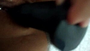 Wife grabs her favorite dildo for some playful homemade fun on camera