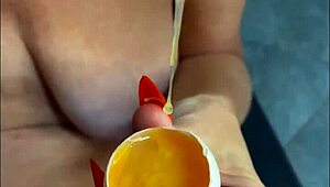 Milf performs taboo handjob insemination with food eggs on huge tits