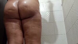 Voyeur catches CURLY chubby CUÑADA stripping in the SHOWER voyeur style