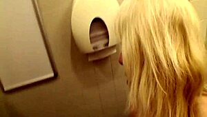 a blonde mature sneaks into the public mall restroom for a wild blowjob and cumshot
