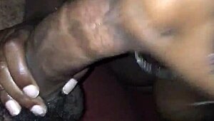 The young black teen gulps down cock with sloppy deepthroat action in homemade vid