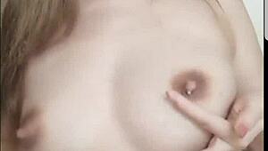 chinese beauty pours fresh milk over her perky asian tits seductively