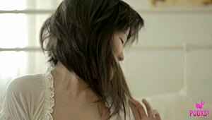 Naughty Asian brat FEN O SMILES teasing small tits to orgasm on bed