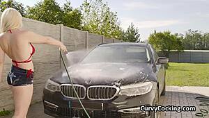 Girlfriend's massive tits get tittyfucked hard while cleaning the car