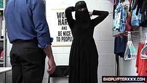 Security officer Justin Magnum busts Delilah Day stealing underwear under hijab then creampies her in backroom