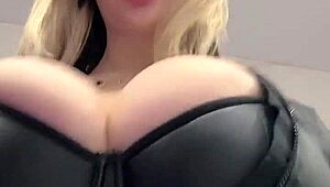 juicy milf boobs strain against tight elastic leather top