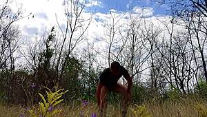 handsome muscular guy strokes monster cock naked in public park