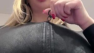 juicy milf boobs strain against tight elastic leather top