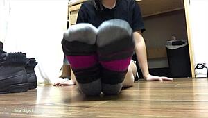 Asian cougar slips wrinkled feet and toes out of puma socks for teasing fetish view