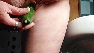 granny fucks hairy pussy with thick cucumber!!