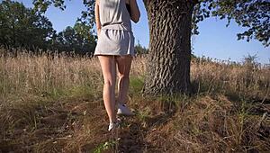 girl lifts short skirt outdoors flashing full back panties for voyeur tease