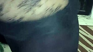 Shiny spandex clings to mature woman's huge jiggling ass cheeks during tease