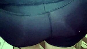 Shiny spandex clings to mature woman's huge jiggling ass cheeks during tease