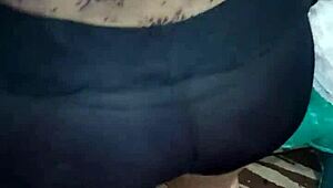 Shiny spandex clings to mature woman's huge jiggling ass cheeks during tease