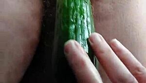 granny fucks hairy pussy with thick cucumber!!