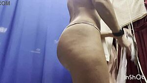 girl slips off dress in public locker room on cam