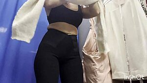 girl slips off dress in public locker room on cam