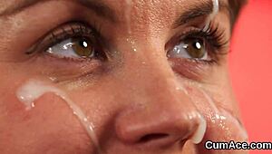 Sexy centerfold slurps jizz facial from bukkake blast.