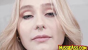 Green-eyed 22-year-old blonde babe oils up and takes 12-inch BBC deep in tight ass after cunni