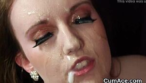 Sexy centerfold slurps jizz facial from bukkake blast.