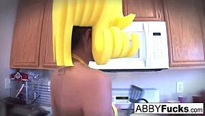 abigail slips into a dress in the kitchen and fucks her huge cucumber deep