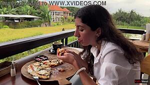 Pizza slice hides cum facial dripping down my chin at cafe table