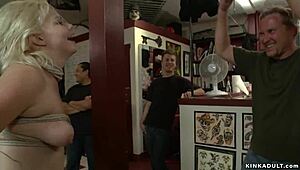kinky slut deepthroats while bound and banged in tattoo shop chaos