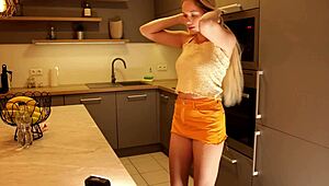 Long Haired Blonde College Coed Lifts Miniskirt in Kitchen Heels Exposing Legs and Ass