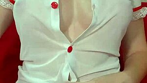 hey look at this pretty blonde in see-through dress squeezing her huge tits up close