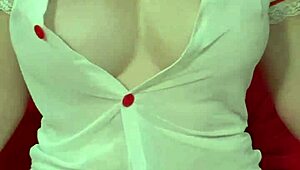 hey look at this pretty blonde in see-through dress squeezing her huge tits up close