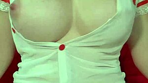 hey look at this pretty blonde in see-through dress squeezing her huge tits up close