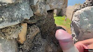 girl flashes huge cock publicly on beach, scares her at first but she strokes it anyway