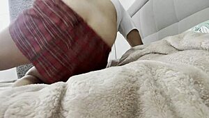 Stepsister's wet pussy throbs as she caresses watching TV panty-free