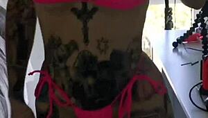 Melody Radford's huge tits and tattooed ass barely fit in micro bikini slut tease