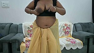 Desi aunt in saree lifts blouse to flash her full tits teasingly
